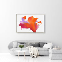 Abstract giclee canvas painting with bold orange, pink, and purple paint splashes above a gray sofa.