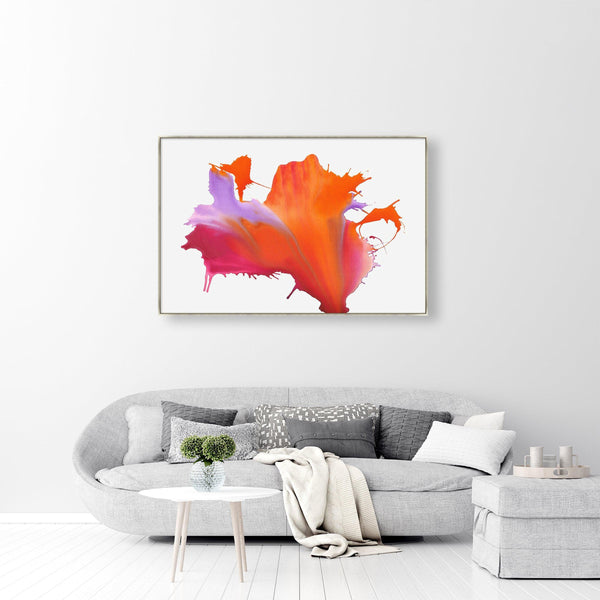 Abstract giclee canvas painting with bold orange, pink, and purple paint splashes above a gray sofa.