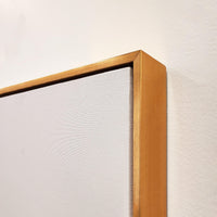 Close-up of a gallery-wrapped giclee canvas painting with a gold frame, showcasing texture.