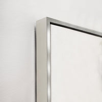 Close-up of a gallery-wrapped giclee canvas painting with a sleek silver frame.