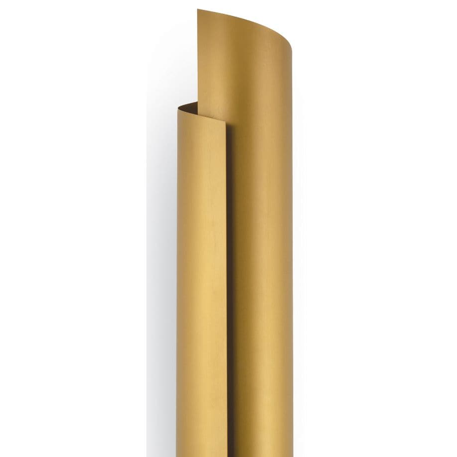 Tall, sleek Flute Sconce in natural brass with a wrapped steel design, casting a soft shadow.