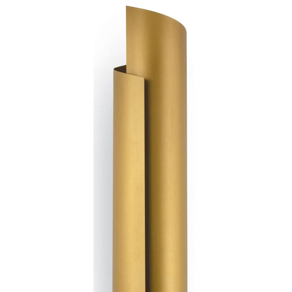 Tall, sleek Flute Sconce in natural brass with a wrapped steel design, casting a soft shadow.