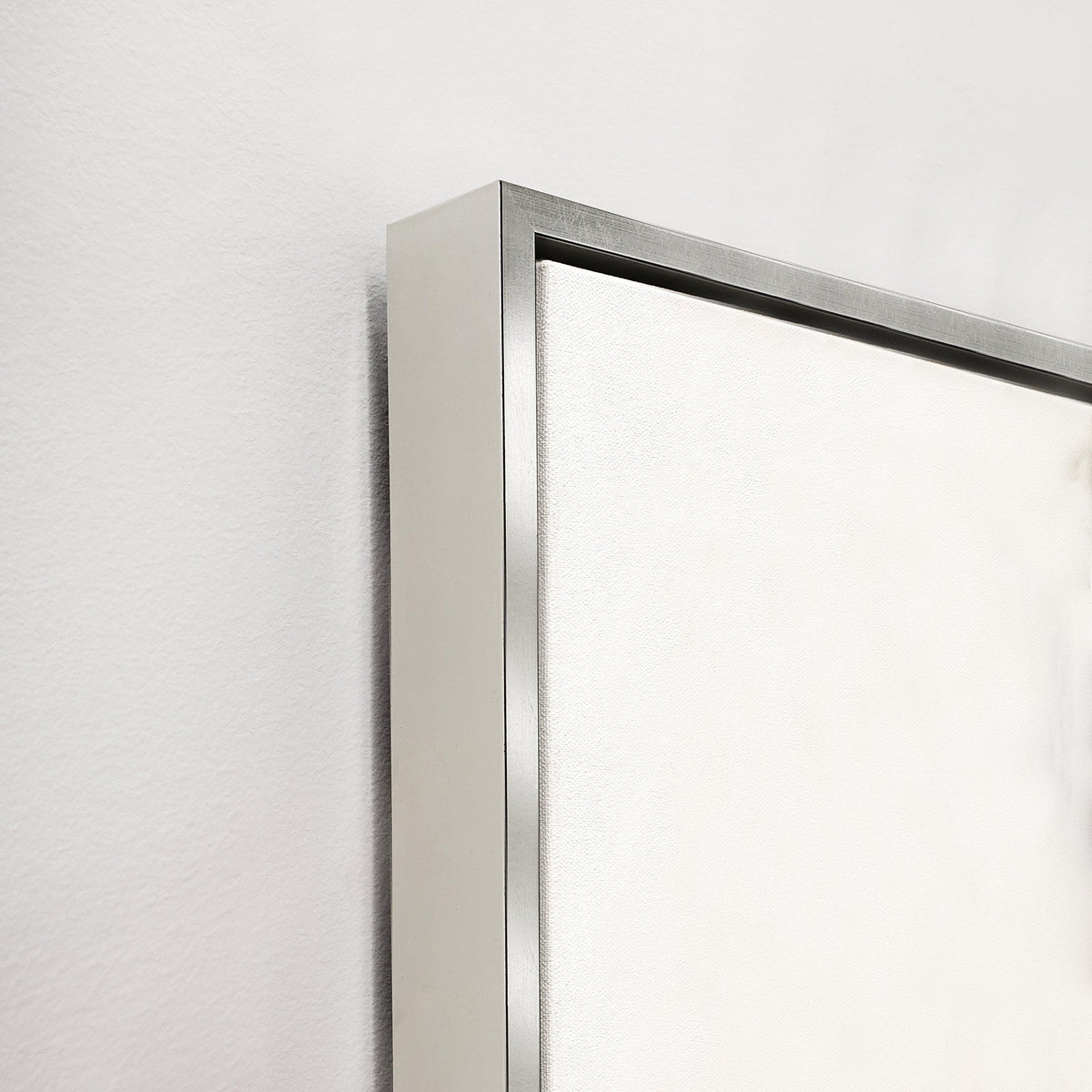 Corner view of "Following Thought II" giclee canvas artwork with a contemporary silver floating frame.