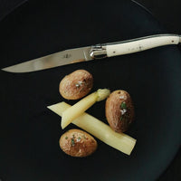 Forge de Laguiole 6 Piece Steak Knife Set Bone Handle - Knife Handle Detail | Bone & Brass