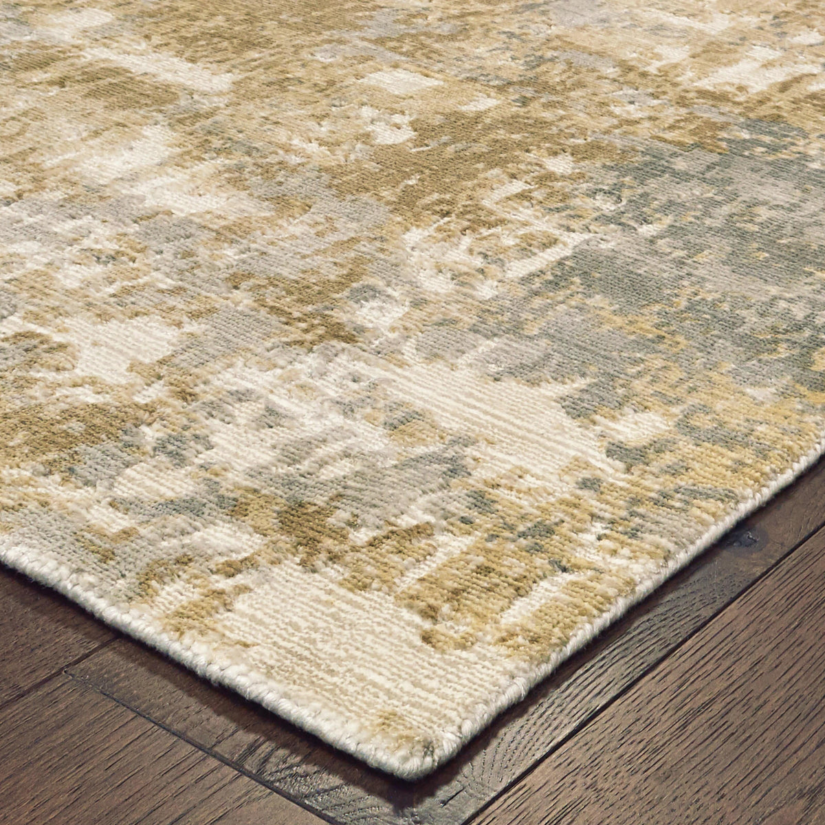 Formations Brown Multi-Colored Casual Rug with organic abstract patterns and hand-carved texture on a wood floor.