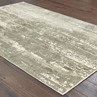 Grey & ivory viscose rug with organic abstract patterns and hand-carved high-low texture on a wood floor.
