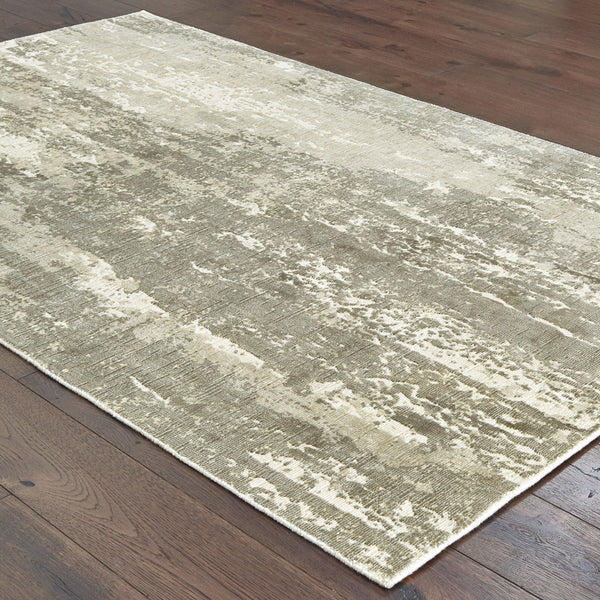 Grey & ivory viscose rug with organic abstract patterns and hand-carved high-low texture on a wood floor.