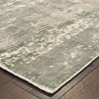 Formations Grey & Ivory Casual Rug with organic abstract patterns and hand-carved high-low texture on a wood floor.