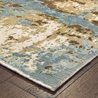 Formations Spa Blue & Brown Casual Rug with abstract patterns and hand-carved high-low texture on wood floor.