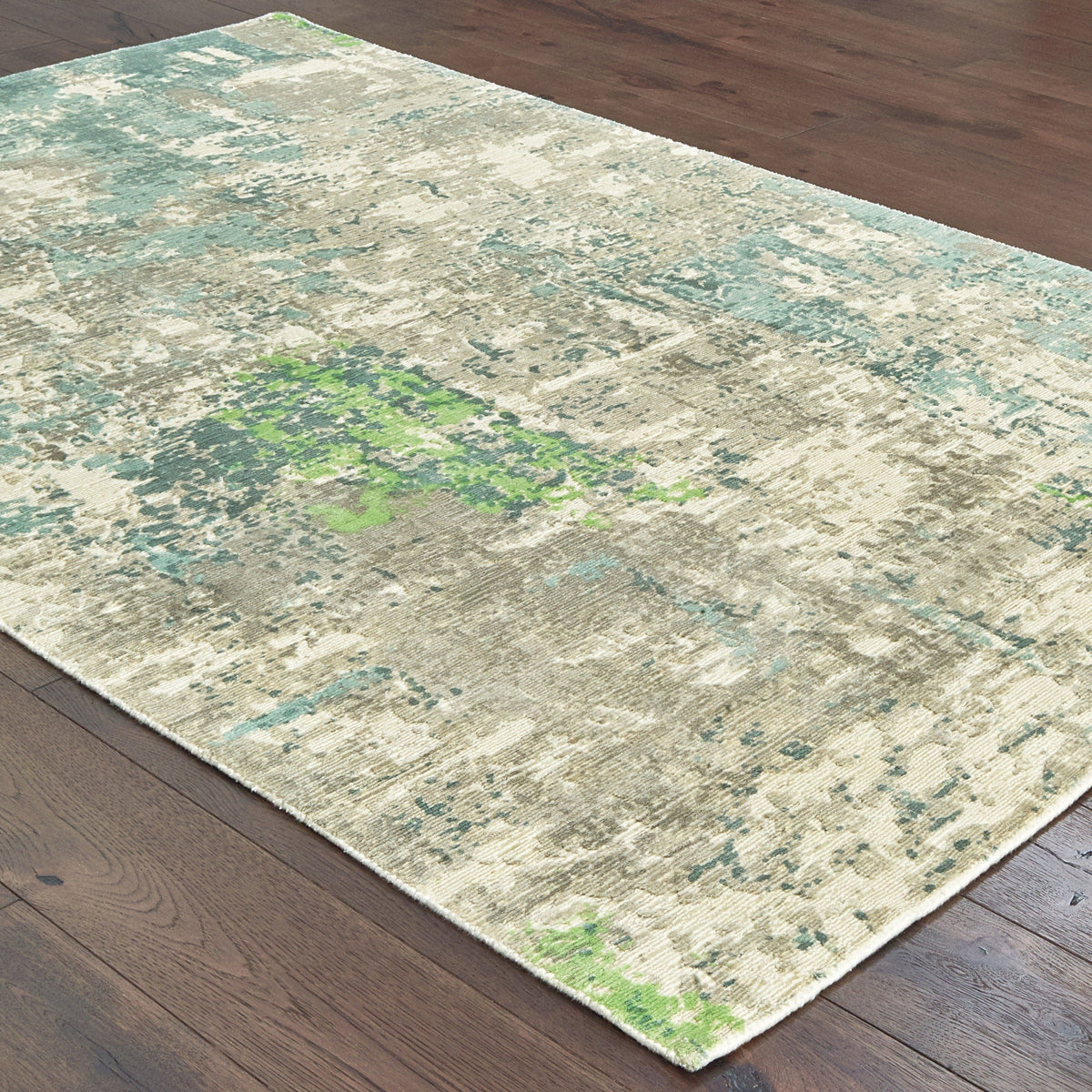 Formations Spa Blue & Green casual viscose rug with organic abstract patterns on dark wood floor.