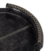 Cognac oval leather tray with baseball stitching and lace-stitched oversized handles.