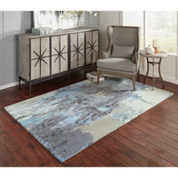 Galaxy Blue & Grey Contemporary Rug with abstract patterns, wool and viscose, on a dark wood floor.