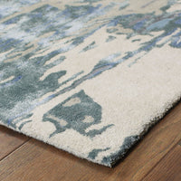 Galaxy Blue & Grey Contemporary Rug with abstract patterns, hand-tufted wool and viscose, on a wood floor.