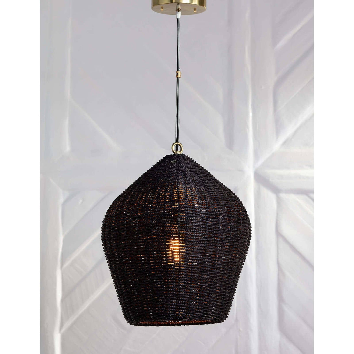 Black rattan Georgian pendant light with natural brass accents, a relaxed coastal or modern farmhouse style.