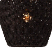 Black rattan Georgian pendant light with a warm glow, showcasing its woven texture and coastal style.