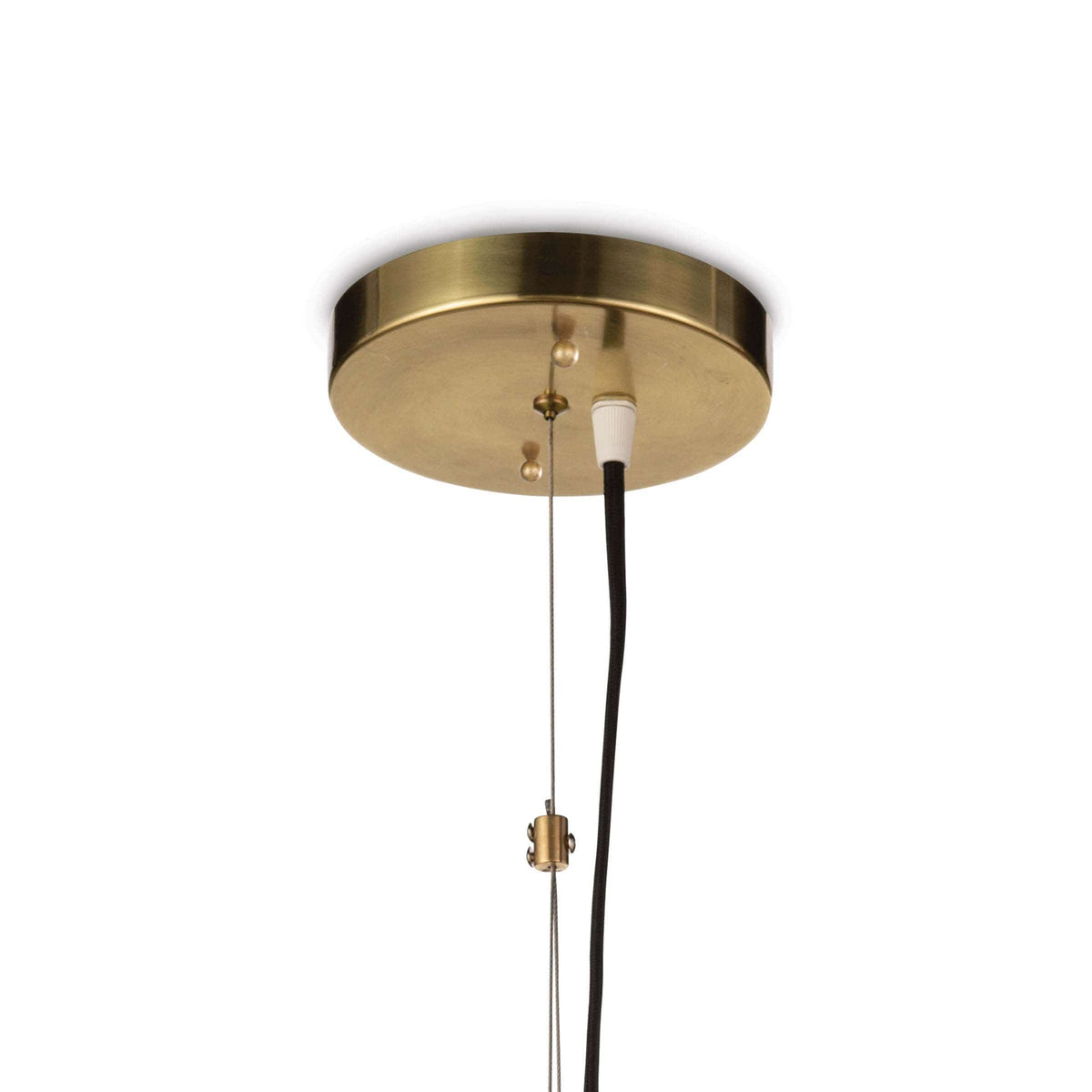 Close-up of a round, natural brass ceiling canopy with a black cord for the Georgian Pendant.