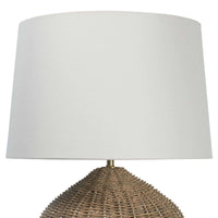 Georgian table lamp with a natural rattan base and a simple natural linen shade.