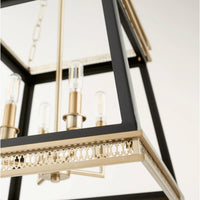 Gerome black and aged brass pendant with open frame, candelabra lights, and decorative trim.