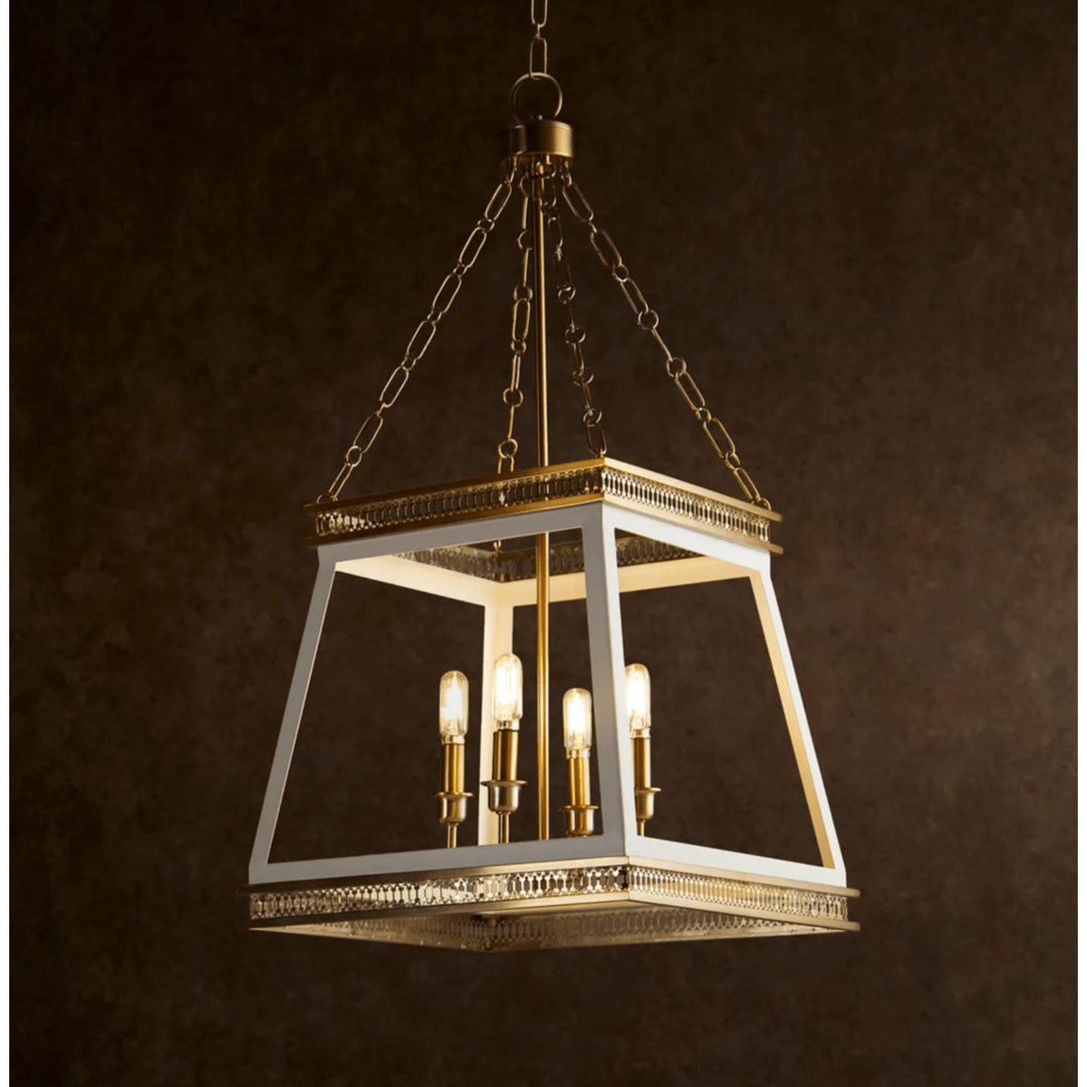 Gerome white and aged brass French country pendant with open frame and four candelabra lights.