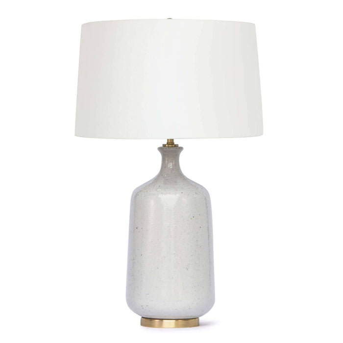 Glace ceramic table lamp with natural hues, brass base, and hand-rolled natural linen shade.