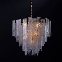 Small Glacier Chandelier with clear water glass panes and white swirls, creating a soft glow.
