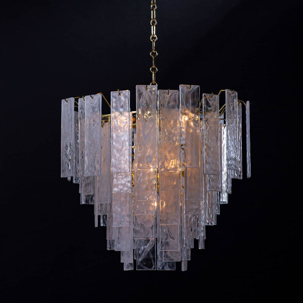 Small Glacier Chandelier with clear water glass panes and white swirls, creating a soft glow.