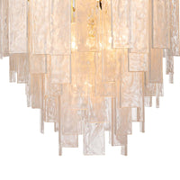 Small Glacier Chandelier with tiered water glass panes and white swirls, diffusing a soft glow.