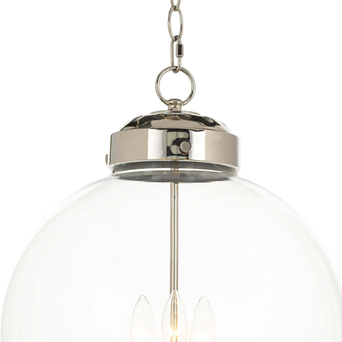 Polished nickel globe pendant light with clear glass and three candelabra-style bulbs.