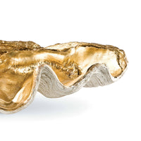 Large golden clam shell decorative bowl with a textured, naturalistic exterior.