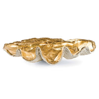 Large golden clam shell decorative bowl with a textured gold interior and natural exterior.