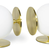 Grant White Bookends: Modern white spherical bodies with natural brass disc bases.