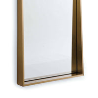 Gunner Mirror with a recessed design and natural brass finish, 60" tall.