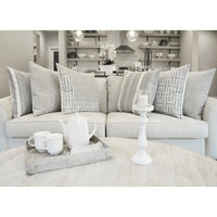Habitat Glacier 24" light gray decorative throw pillows with geometric and striped patterns on a sofa.