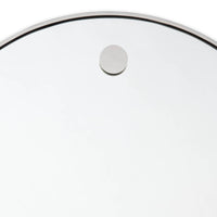 Close-up of a 36" circular mirror with a polished nickel frame and hanging detail.