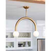 Happy Pendant Small Natural Brass light fixture with two matte white glass globes.