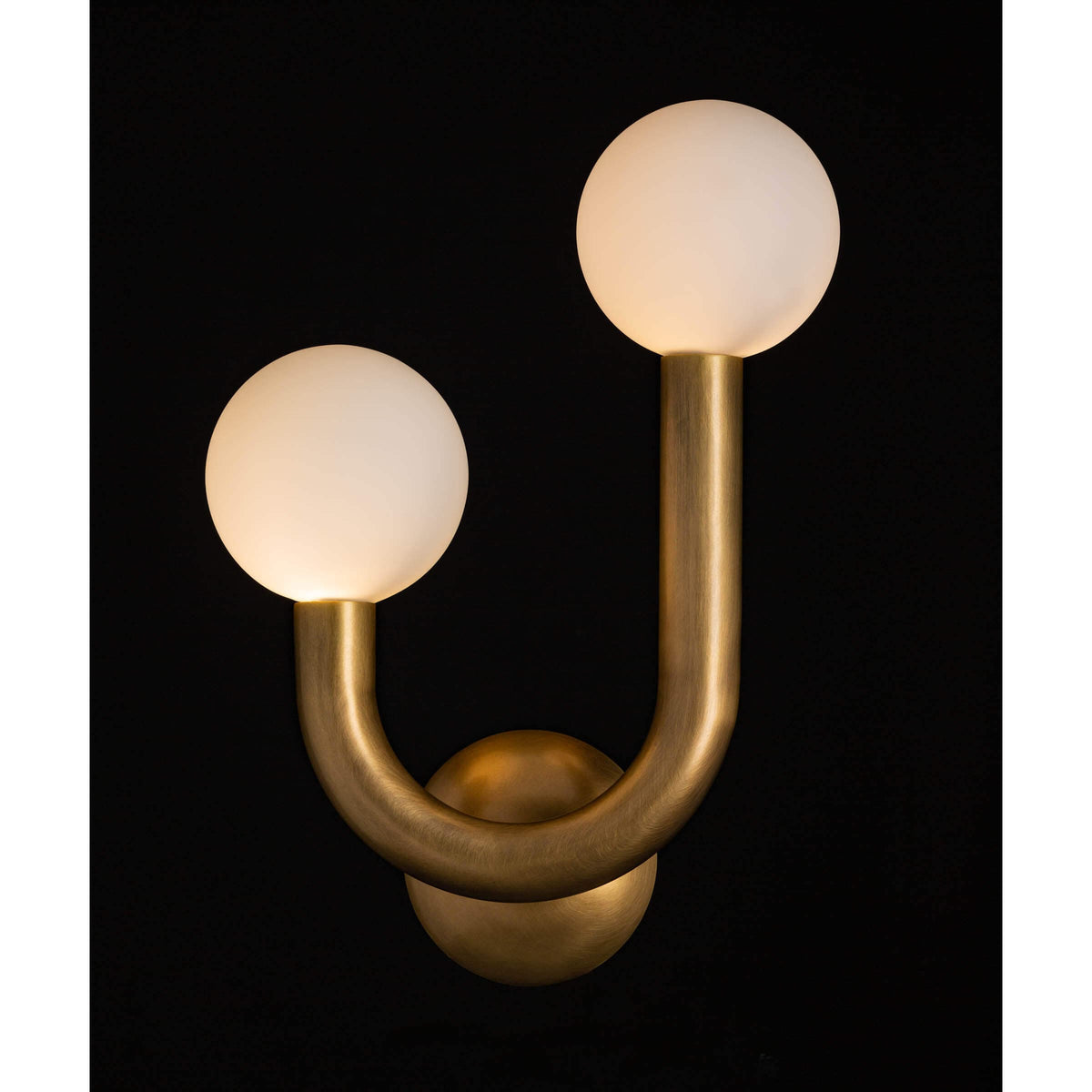 Happy Sconce Left Side in natural brass with two matte white glass globes.