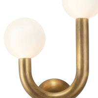 Happy Sconce Left Side in natural brass with two matte white glass globes, modern asymmetrical design.