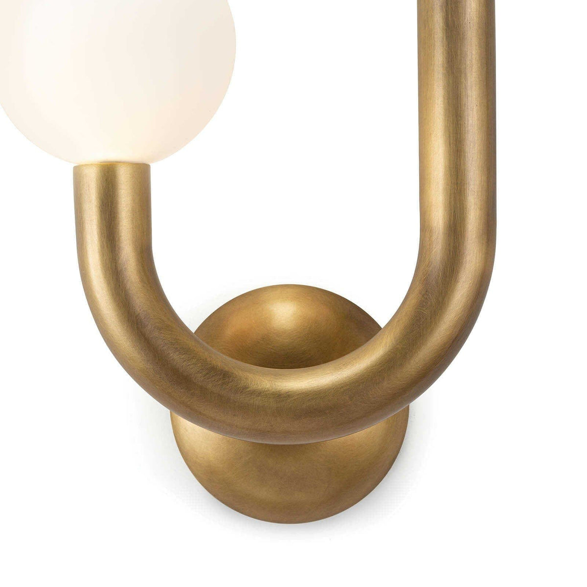 Happy Sconce Left Side in natural brass with a matte white glass globe.
