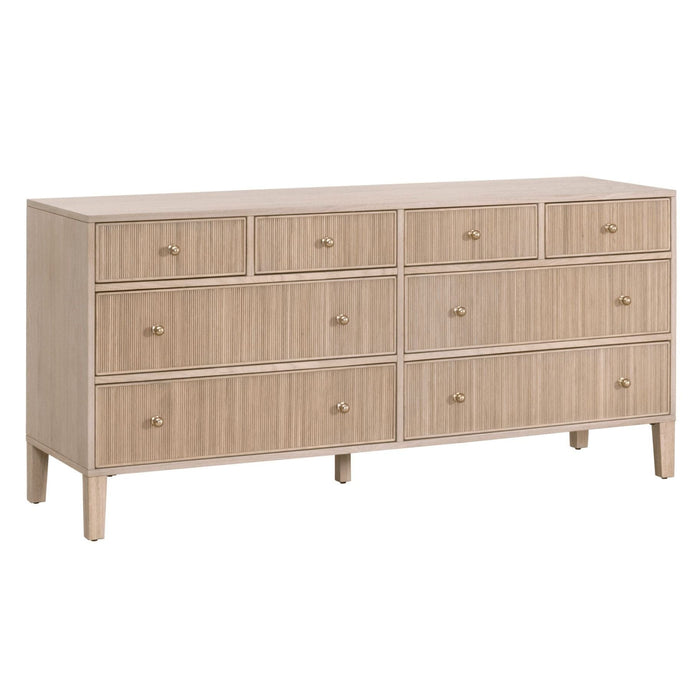 Hargrove natural oak 8-drawer dresser with reeded drawer fronts and gold knobs.