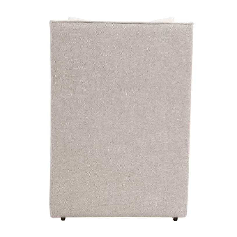 Back view of Harmony French Linen Armchair, light beige fabric with small dark casters.