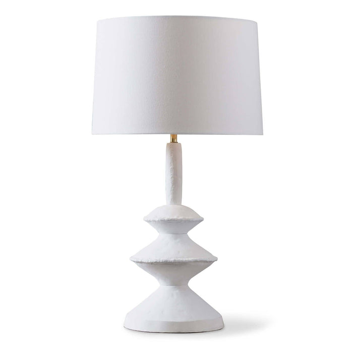 Matte white Hope Table Lamp with a unique, sculpted base and a white linen shade.