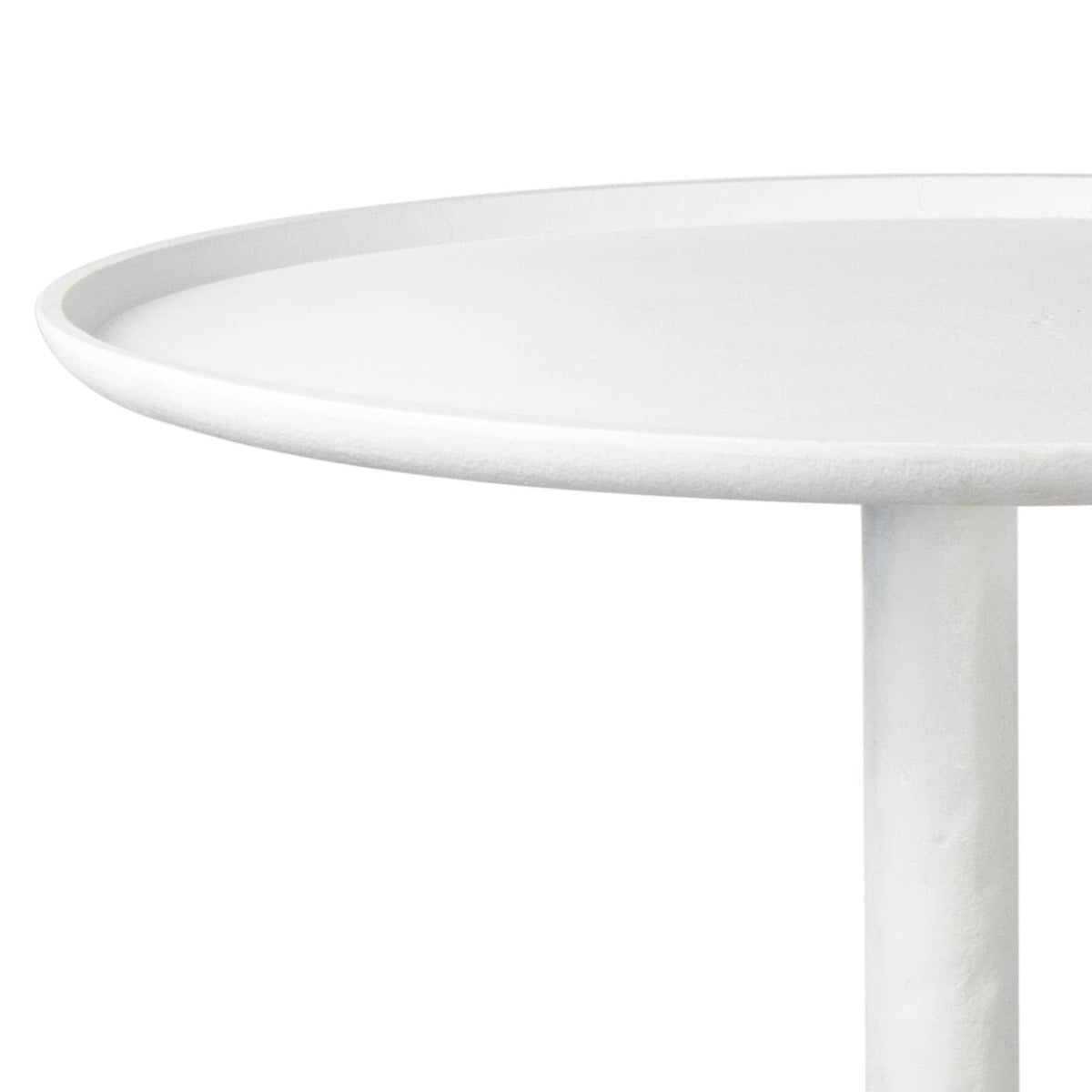 Matte white accent table with a round top and unique, sculptural curves.