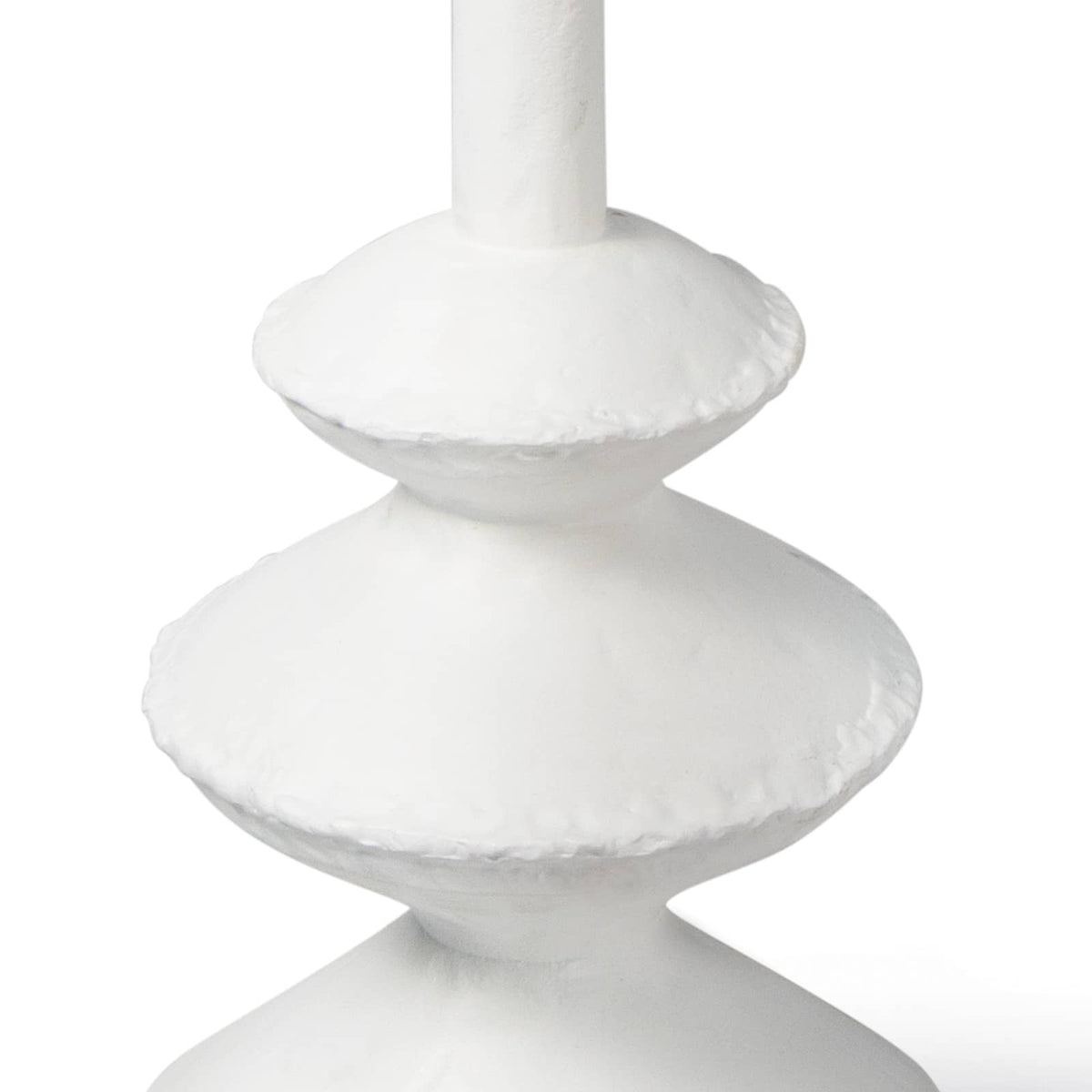 Matte white accent table with complex, paper mache-inspired curves and unique texture.