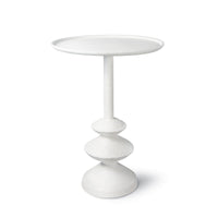 Matte white accent table with complex curves and a unique paper mache-inspired design.