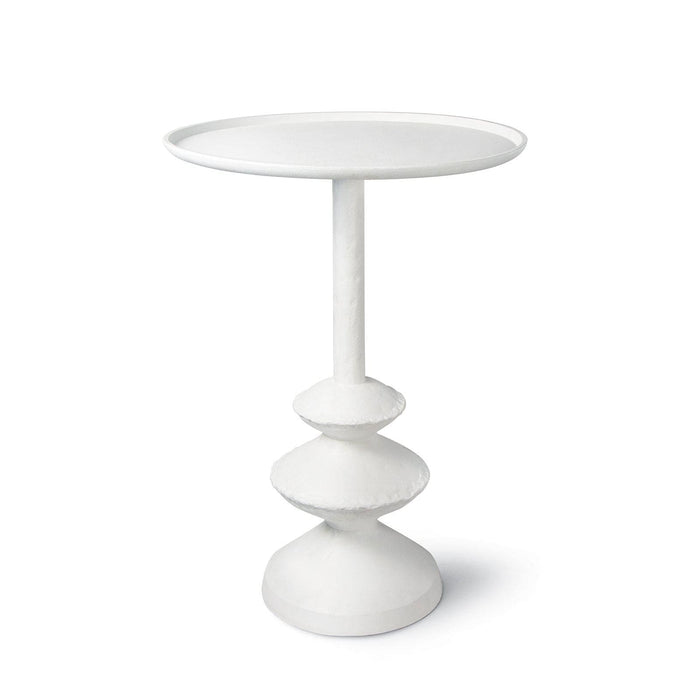Matte white accent table with complex curves and a unique paper mache-inspired design.