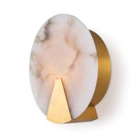 Houston sconce: round natural alabaster with warm light, secured by natural brass framing.