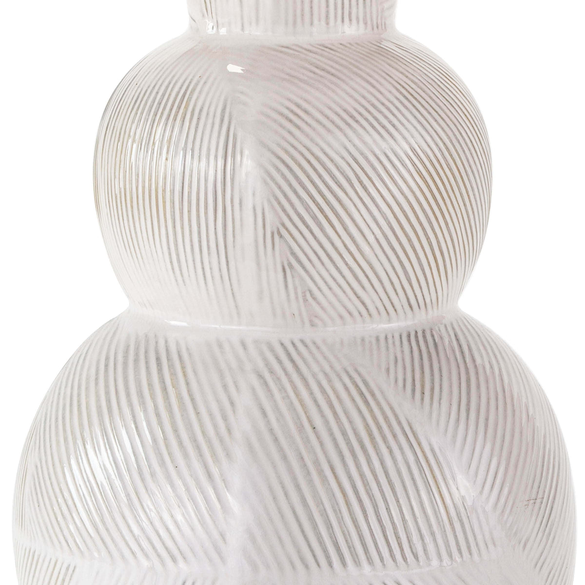 Hugo ceramic table lamp with a textured white earthenware base and subtle highs and lows.