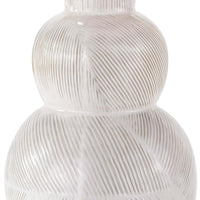 Hugo ceramic table lamp with a textured white earthenware base and subtle highs and lows.