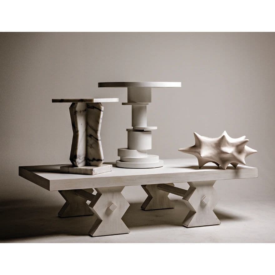 White Hugo Side Table with circular top and unique stacked round base, made of mahogany.
