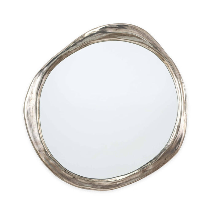 Ibiza Mirror: Organic, undulating antique silver frame with a warm ambered glow.